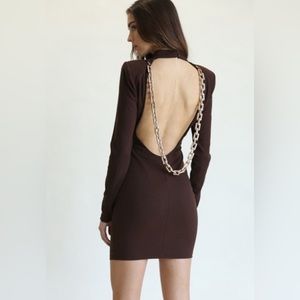 Ribbed Dress with a front and back cutout, high neckline, and chain in the back